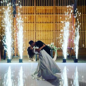 Couple's first dance with sparkling backdrop