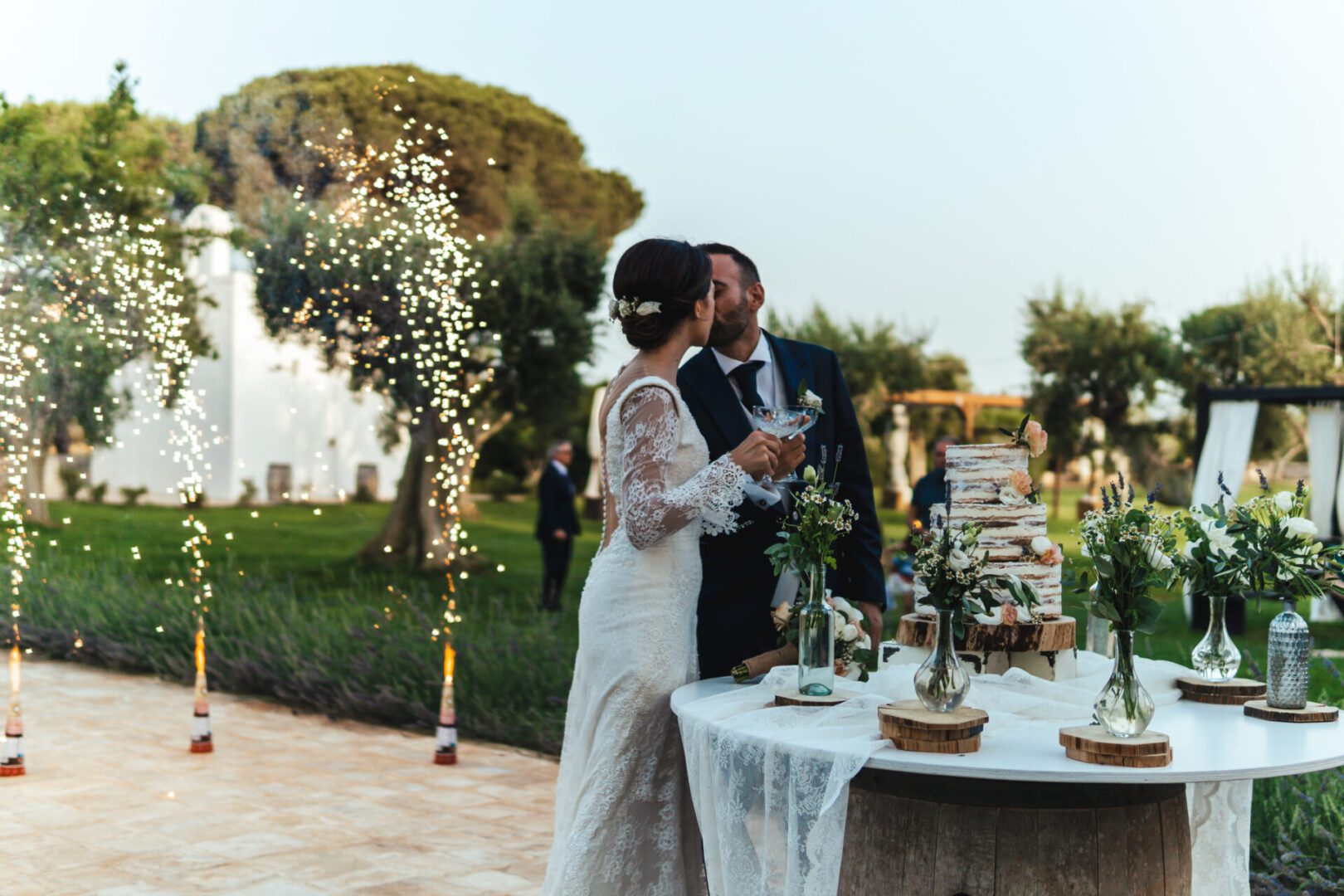 Newlyweds toasting at elegant garden reception