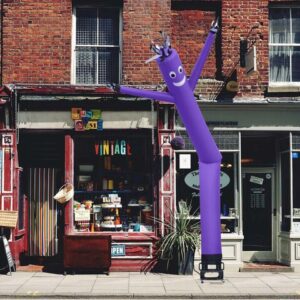Purple air dancer beside vintage store