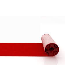 Rolled red carpet on floor